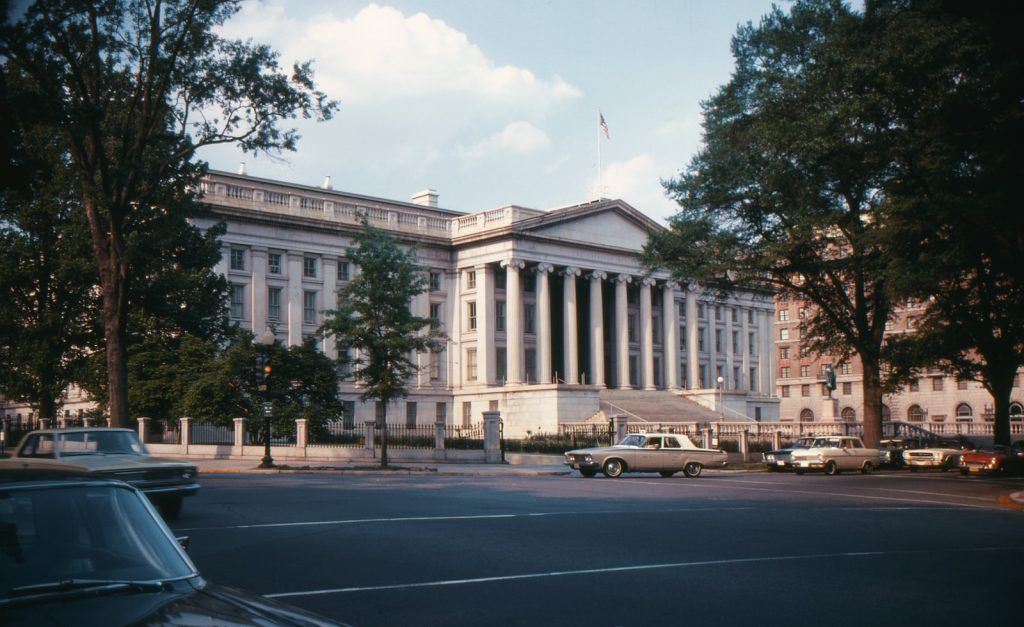 a large white building with columns on the top of it