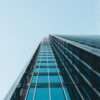 low angle photography of clear glass high-rise building